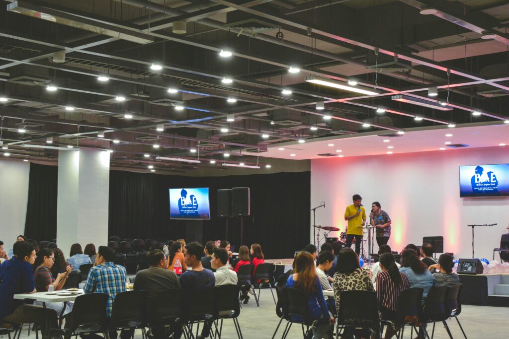 Conference interpreters provide real-time language support during a corporate event, helping diverse attendees engage fully.