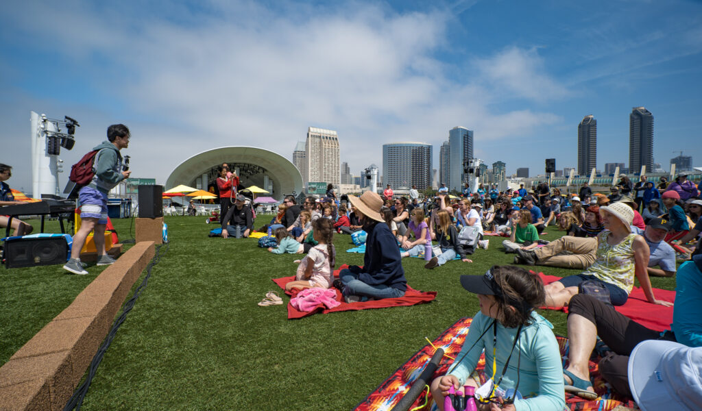 Crowd gathered for a public language and culture event in San Diego, showcasing community interpreting, translation outreach, and inclusive communication.