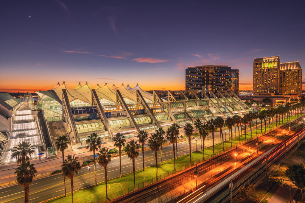 San Diego Convention Center illuminated at sunset, venue for international language services conferences, translation summits, and global interpreting events promoting multilingual communication.